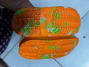 kids Orange Crocs with Green Splatter