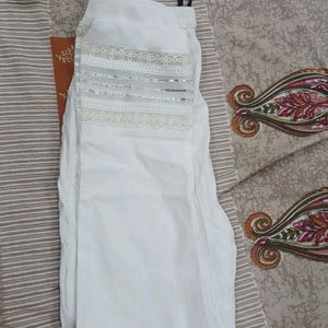 white stretchable pant for suits. size is small and the fabric is stretchable.