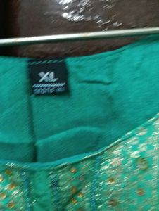 Elegant Green Saree with Gold Floral Print