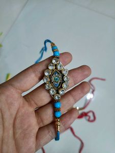 Elegant Rakhi Bracelet with Blue Stones