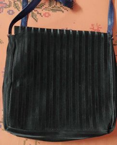 Chic Black Crossbody Bag with Pom Po