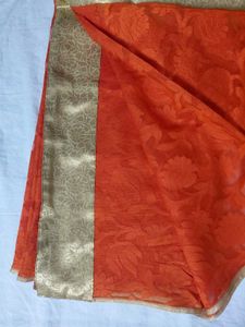 Vibrant Orange Saree with Golden Border