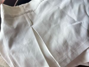 White pleated skort