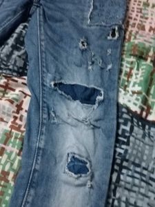 Distressed Blue Denim Jeans