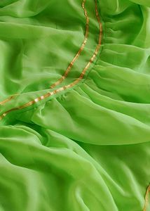 A green party wear sharara with dupatta
