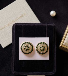 Elegant Round Emerald & Crystal Stud Earrings