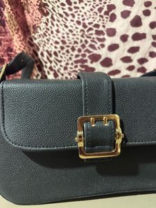 Chic Black Crossbody Bag with Gold Buckle