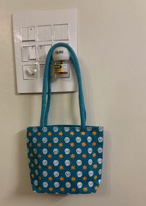 Teal Handbag with Swirl Pattern
