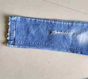 Distressed Blue Denim Jeans