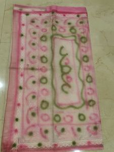2 organza sarees one orange and another is pink on