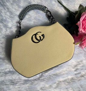 BRAND NEW Chic Beige Mini Handbag with Statement C