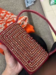 Red Embroidered saree and Blouse with Handbag