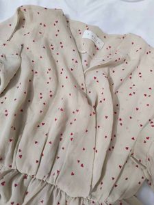 Chic Beige Heart Print Peplum Top