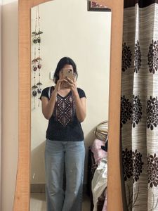 Stylish Black Top with Embroidered Neckline