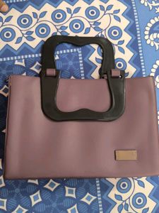 Chic Purple Handbag with Unique Handle
