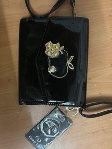 Shiny Black Clutch with Apple Embellishment
