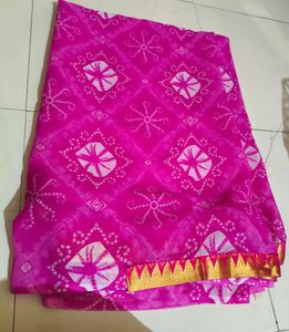 Vibrant Pink Bandhani Saree with Gold Border