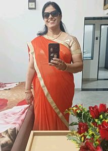 Vibrant Orange Saree with Golden Border
