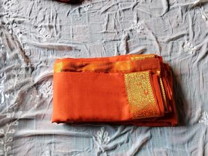 Vibrant Orange Saree with Golden Border