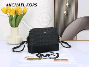 MICHAEL KORS* *MEDIUM LOGO DOME CROSSBODY SLING BA