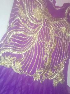 Elegant Purple Gown with Gold Embellishments