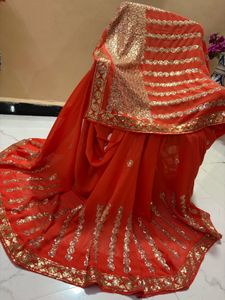 Vibrant Orange Sequined Saree