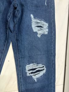 Distressed Blue Denim Jeans