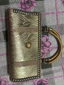 Elegant Gold Clutch Bag with Embellishments