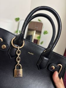 Chic Black Aldo Handbag with Lock Detail