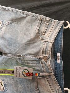 Light Wash Distressed Denim Jeans
