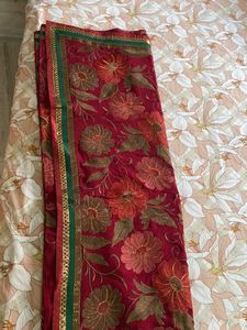 Maroon coloured Embroidered saree With Stitched blouse