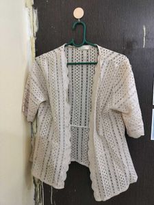 shrug in beige colour