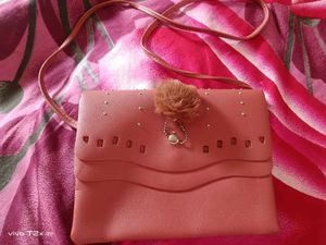 Stylish Pink Clutch with Pom-Pom