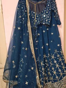 Stunning Teal lengha choli with Silver Embellishme