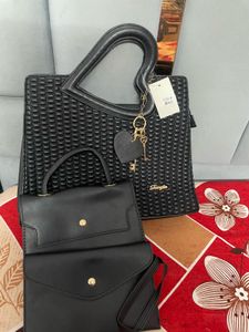 Stylish Black Handbag with Heart Handle