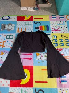 black crop to with long flared sleeves