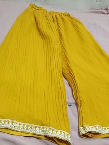 mustard colour plazo and off white top