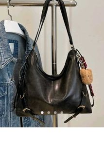 adjustable buckle shoulder bag