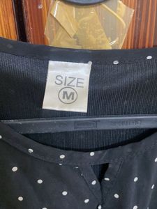 Black polka dot dress