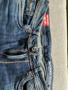 Distressed Blue Denim Jeans