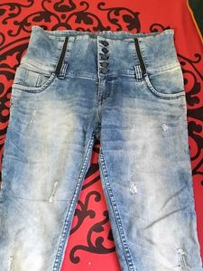 39.Distressed High-Waisted Blue Jeans