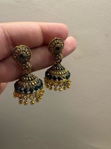 Gold Jhumka Earrings with Green Stones