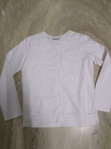 White sweater top with beautiful cut work....store