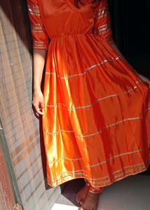 Vibrant Orange Kurta Set with Golden Accents