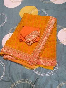 Elegant Orange Saree with Embellishments