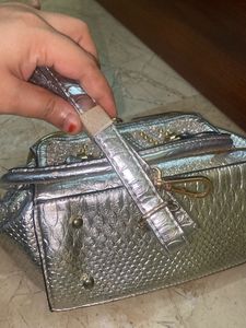 silver solid hand bag