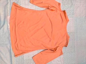 Brand new unused peach top with necklace attached