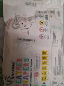 pack of Sanitary Napkins and baby diapers