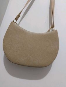 Stylish Beige Hobo Bag with Gold Chain