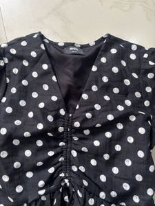 Black Polka Dot Ruched Peplum Top